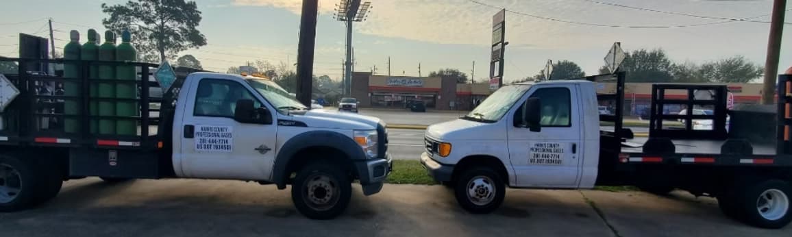 Harris County Professional Gases delivery trucks loaded with gas cylinders